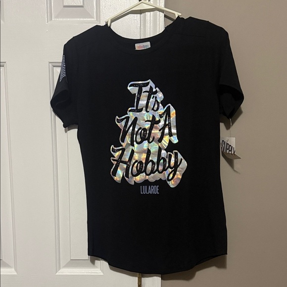 LuLaRoe Tops - LuLaRoe “It’s Not A Hobby” Graphic Tee | XS Black Holographic Logo | NWT